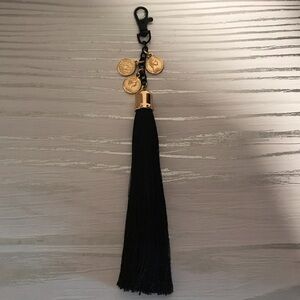 Aldo Black Tassel Bag Charm with Gold Coin Accents